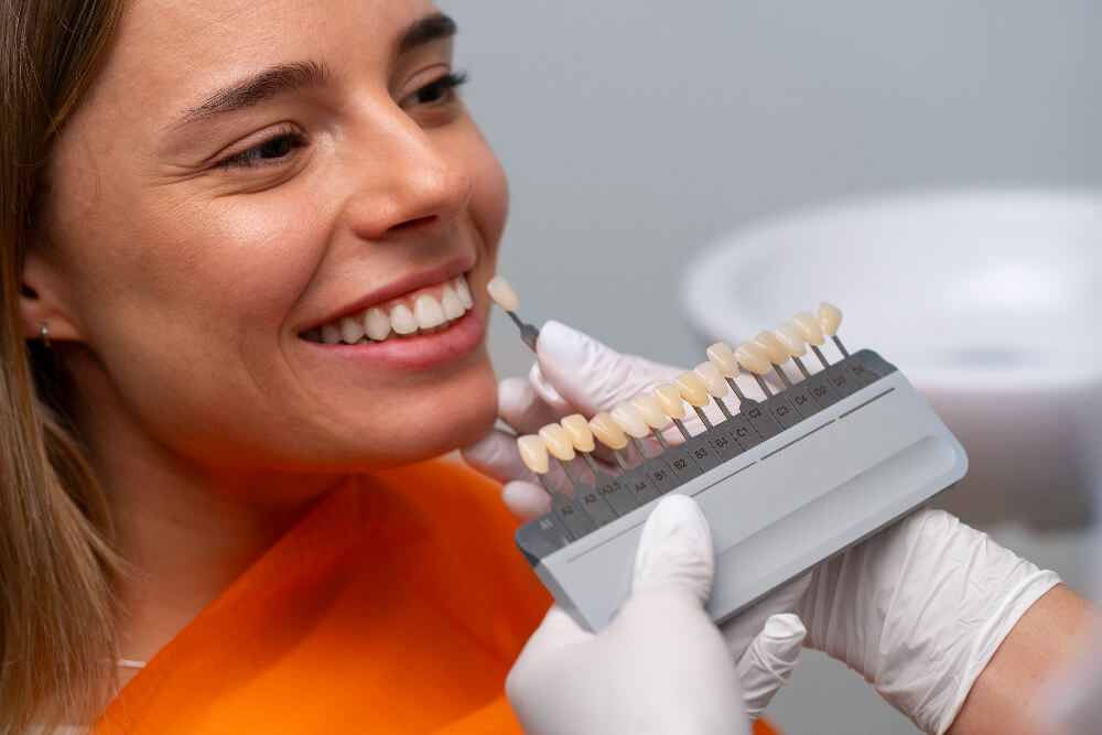 a woman choosing the perfect veneer shade